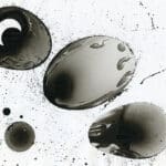 A black and white painting with splatters on it.