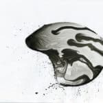 A black and white drawing of a skull.